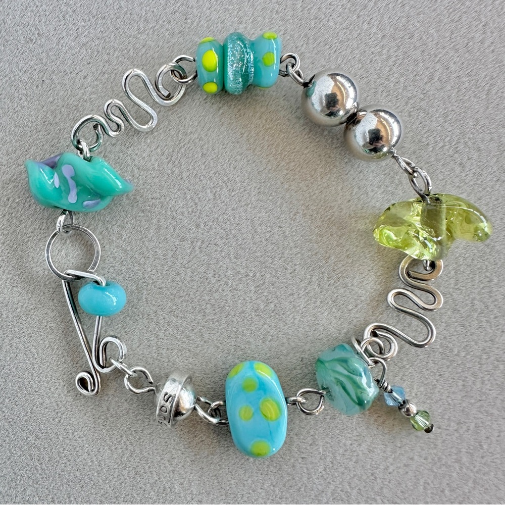 Artisan-made sterling silver and glass bead charm bracelet